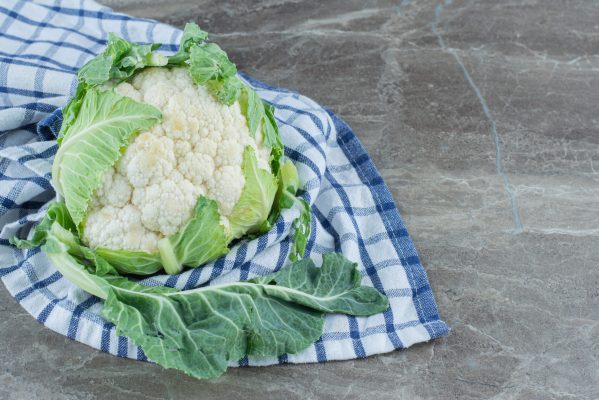 Close up photo Fresh organic cauliflower on grey background. High quality photo